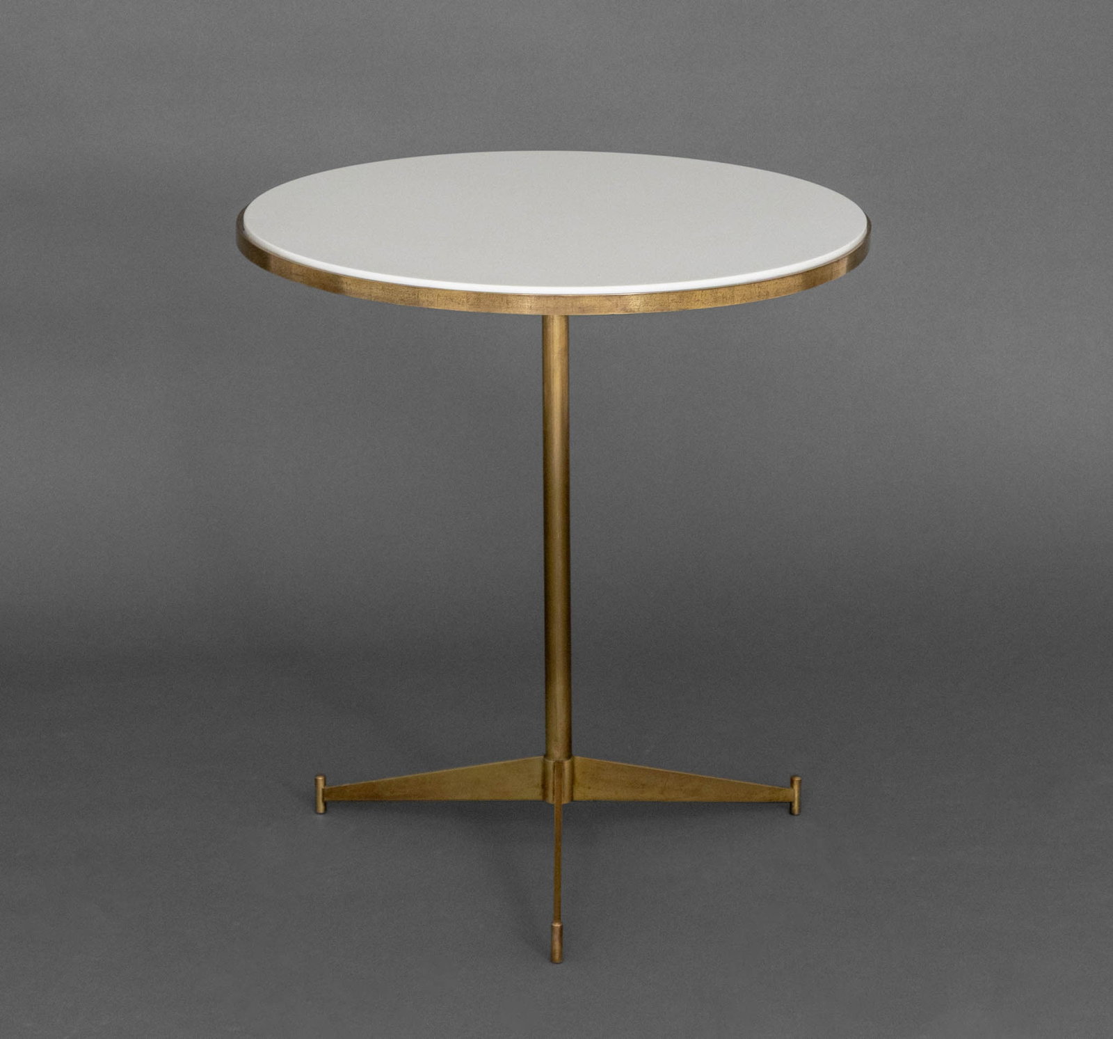 Paul McCobb for Directional Brass Tripod Table: Paul McCobb (American, 1917-1969) for Directional Brass Tripod Side Table, with circular white glass top. 22.25" H x 20.5" Diameter. Provenance: From a 35 Sutton Place Estate. Keywords: Designer,
