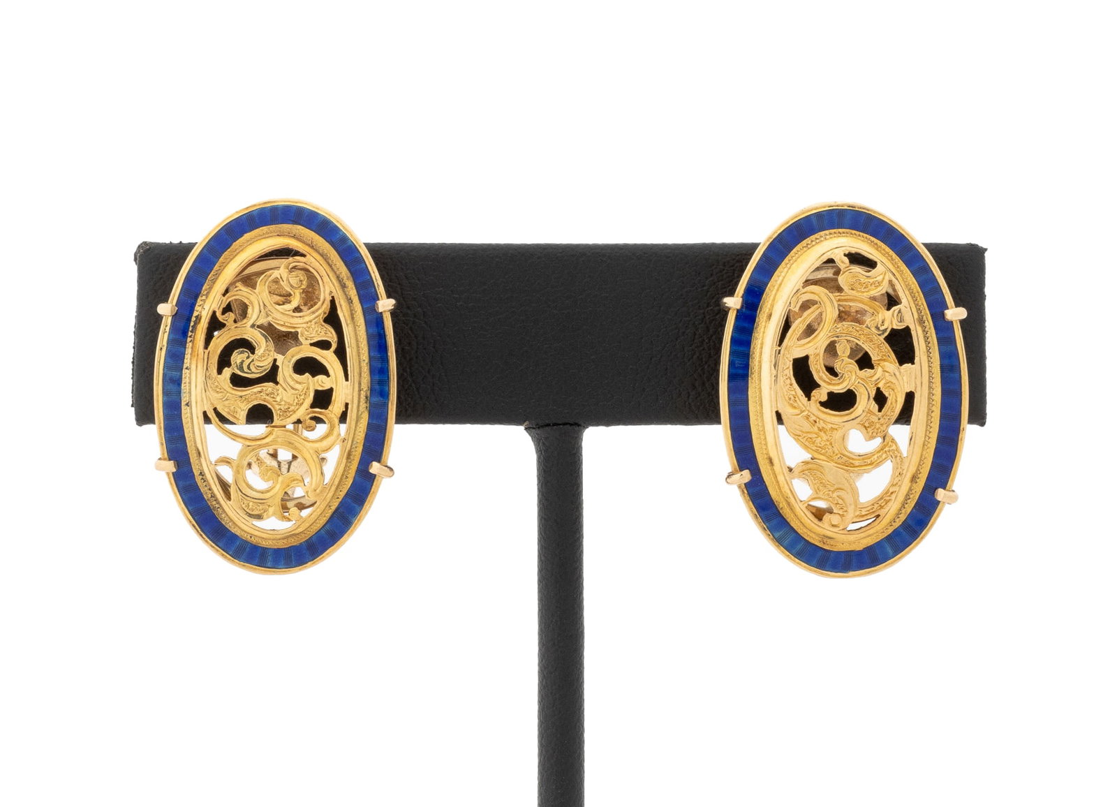 Cobalt Blue Enamel & Yellow Gold Filigree Earrings: Pair of 18K and 14K Yellow Gold and Cobalt Blue Enamel Filigree Earrings, featuring two prong set 18K yellow gold oval filigree segments decorated with cobalt enamel borders, worn as clip ons with
