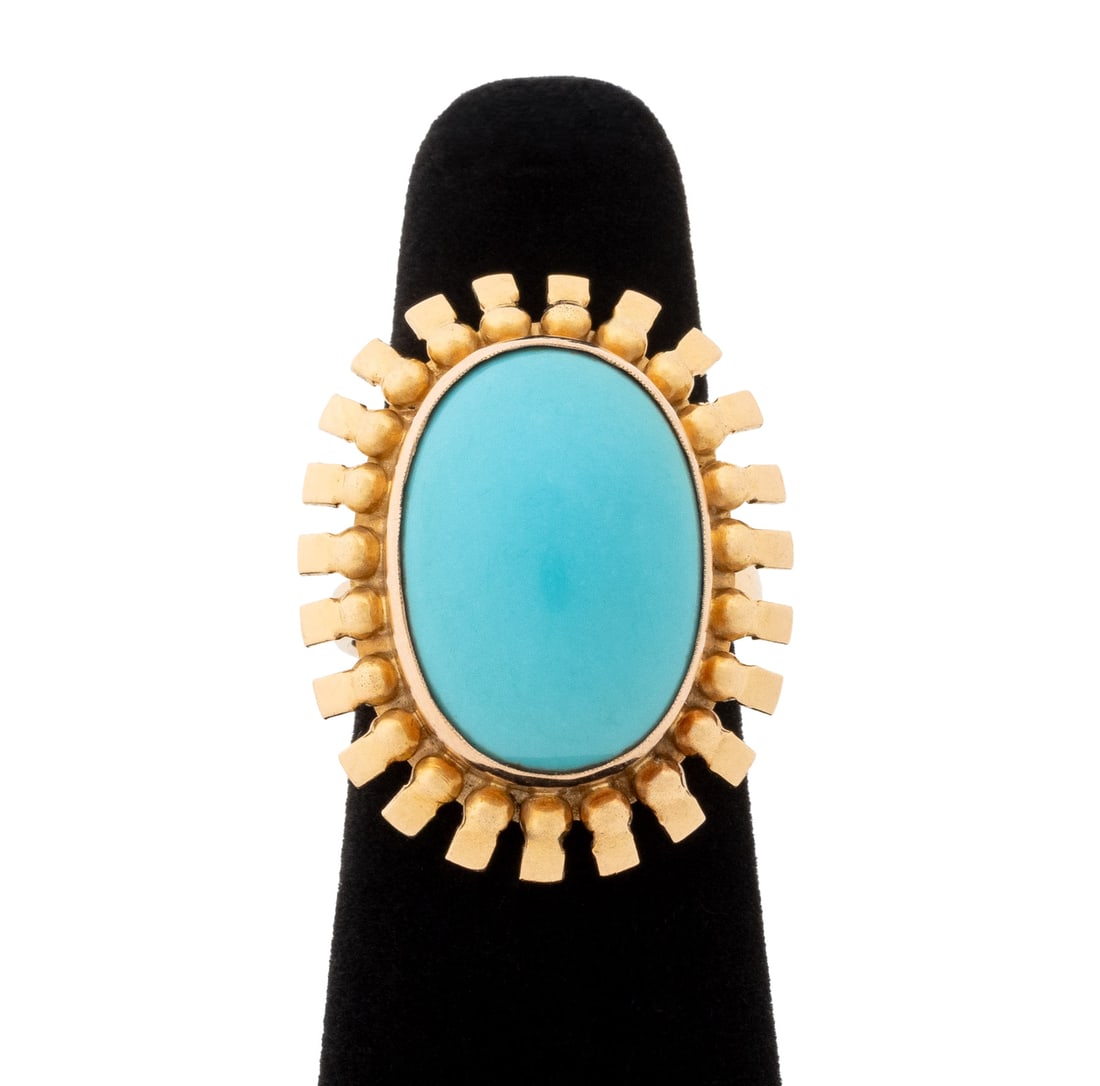 Sunburst Motif Yellow Gold and Turquoise Ring: Sunburst Motif 18K Yellow Gold and Turquoise Ring, featuring one bezel set oval turquoise cabochon weighing approx. 12.50 carats. Gold tested 18K alloy purity. Measuring approx. US size 5 1/2 with siz