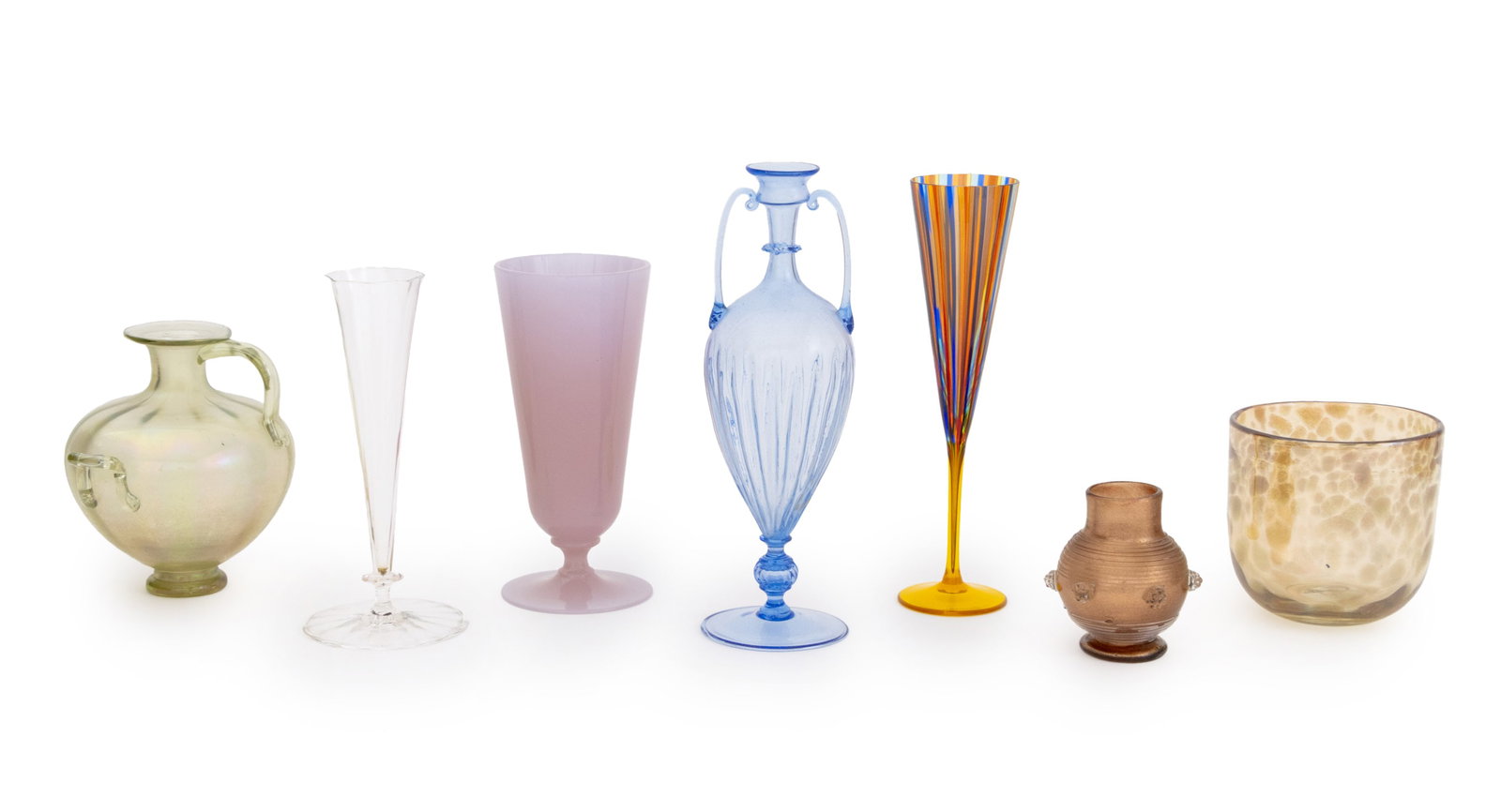 Collection of Murano Glass Vessels, 7: Collection of Seven Murano Glass Vessels, comprising: a Cenedese striped polychrome glass champagne flute, a colorless champagne flute, a Cenedese opaque purple glass footed vase, a verre se soie glas