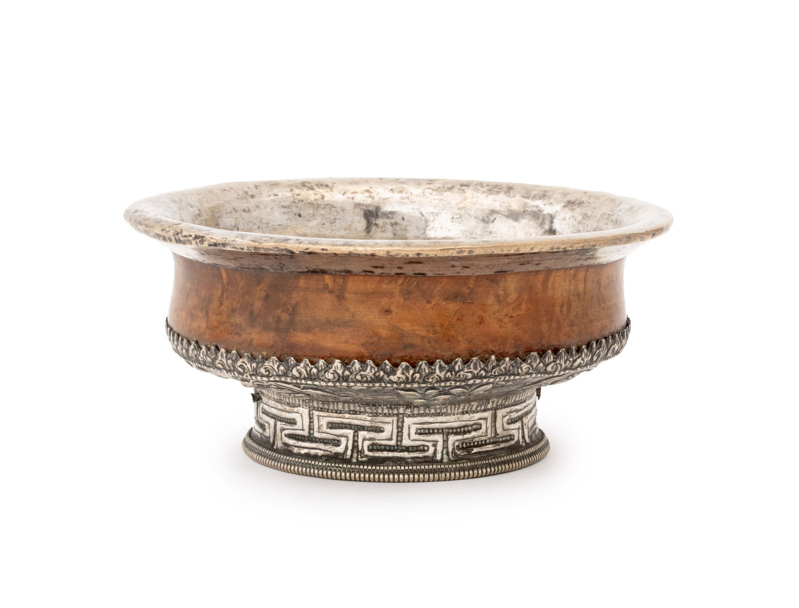 Tibetan Silver Mounted Burlwood Bowl, 19th C.: Tibetan Silver Mounted Burlwood Ritual Bowl, 19th century, the foot with scrolling floral motif chased and repousse decoration. 2.75" H x 6" Diameter. Provenance: From an East 57th Street Estate. Keyw