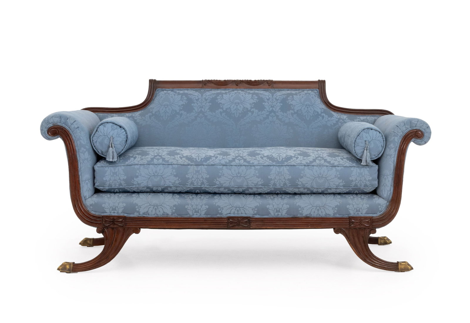 Regency Style Blue Damask Upholstered Sofa: Regency Style Blue Damask Upholstered Sofa, the mahogany frame with carved cresting and terminating in paw feet. 32" H x 65" W x 32" D; seat: 18" H. Provenance: From a West End Avenue Collection.
