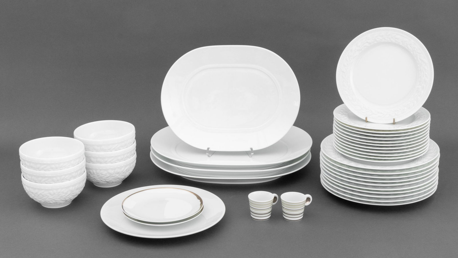 Bernardaud Porcelain Assembled Service, 37 Pcs.: Bernardaud French Porcelain Partial Assembled Service, all marked and comprising: (6) bowls in the "Louvre" pattern, (12) dessert plates, (10) dinner plates and (1) glazed white porcelain, (2) cafe no