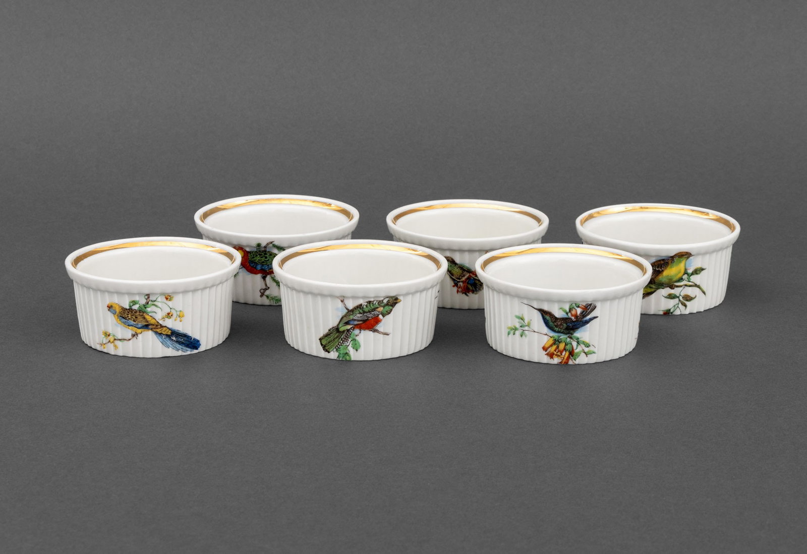 Pillivuyt & Cie. Porcelain Ramekin Cups, 6: Set of Six Pillivuyt Porcelain Ramekin Cups, with gilt trim and bird motif, marked "Porcealines a Feu Pillivuyt & Cie / Mehun / Made in France / 664" to undersides. 1.5" H x 3" Diameter. Provenance: F