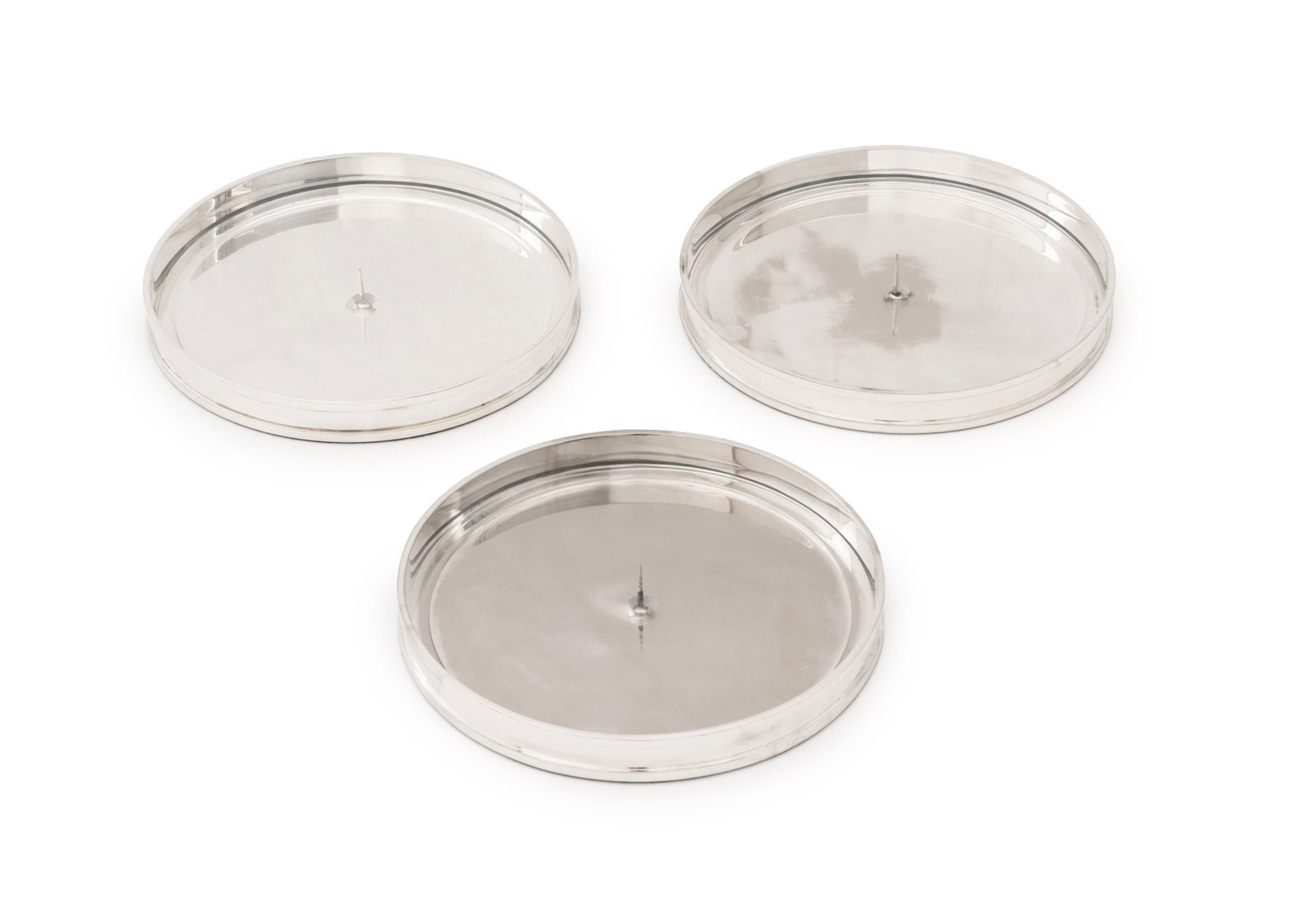 Ralph Lauren Silver Plate Candle Pricket Stands, 3: Set of Three Ralph Lauren Silver Plate Candle Pricket Stands, each marked to side and with clear acrylic insert. 9.25" Diameter x 1.25" D. Provenance: From a 500 Park Avenue Estate. Keywords: