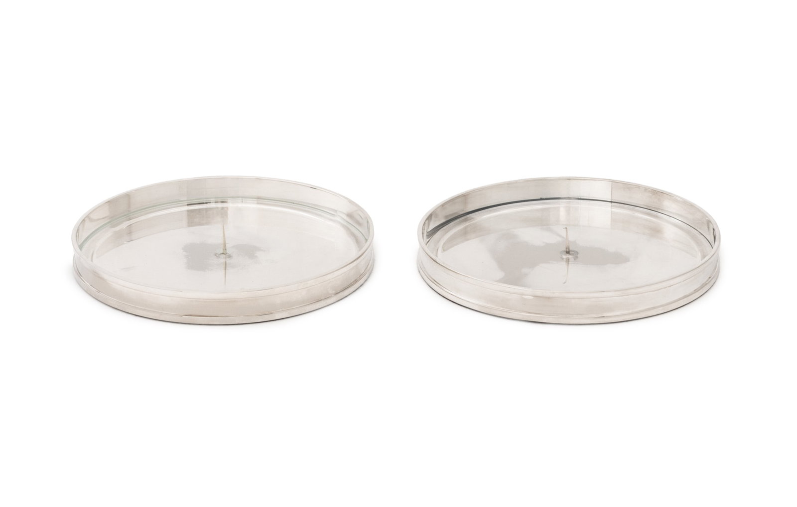 Ralph Lauren Silver Plate Candle Pricket Stands, 2: Pair of Ralph Lauren Silver Plate Candle Pricket Stands, each marked to side and with clear acrylic insert. 9.25" Diameter x 1.25" D. Provenance: From a 500 Park Avenue Estate. Keywords: Designer,