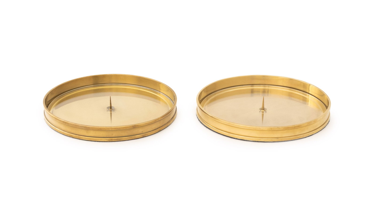 Ralph Lauren Brass Candle Pricket Stands, Pair: Pair of Ralph Lauren Brushed Brass Candle Pricket Stands, each marked to side and with clear acrylic insert. 9.25" Diameter x 1.25" D. Provenance: From a 500 Park Avenue Estate. Keywords: Designer,
