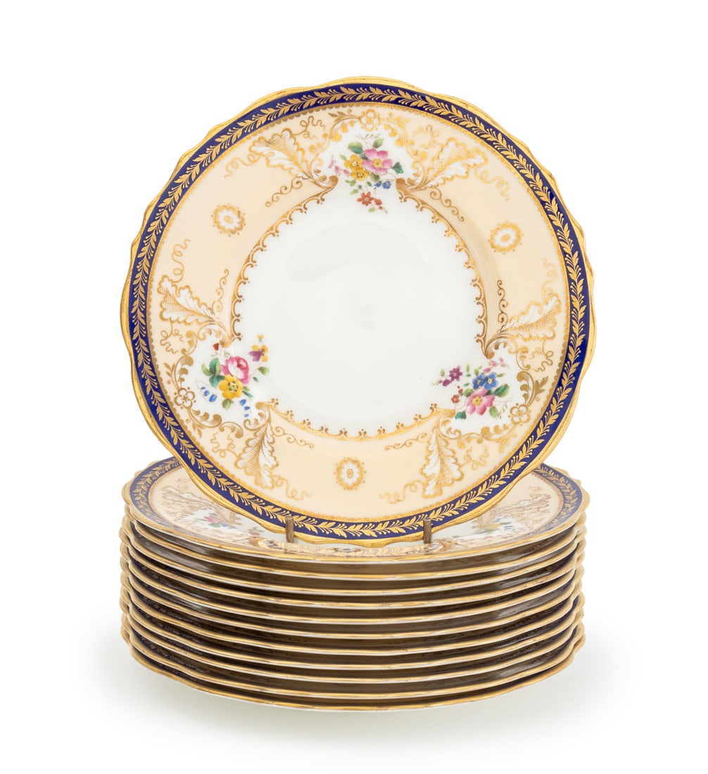 Cauldon for Tiffany & Company Porcelain Plates, 12: Set of 12 Cauldon for Tiffany and Company Porcelain Plates, with scalloped rim and floral decoration, marked "Cauldon China / England" and "Tiffany & Co. / New York" to underside. 8.5" Diameter. Prove