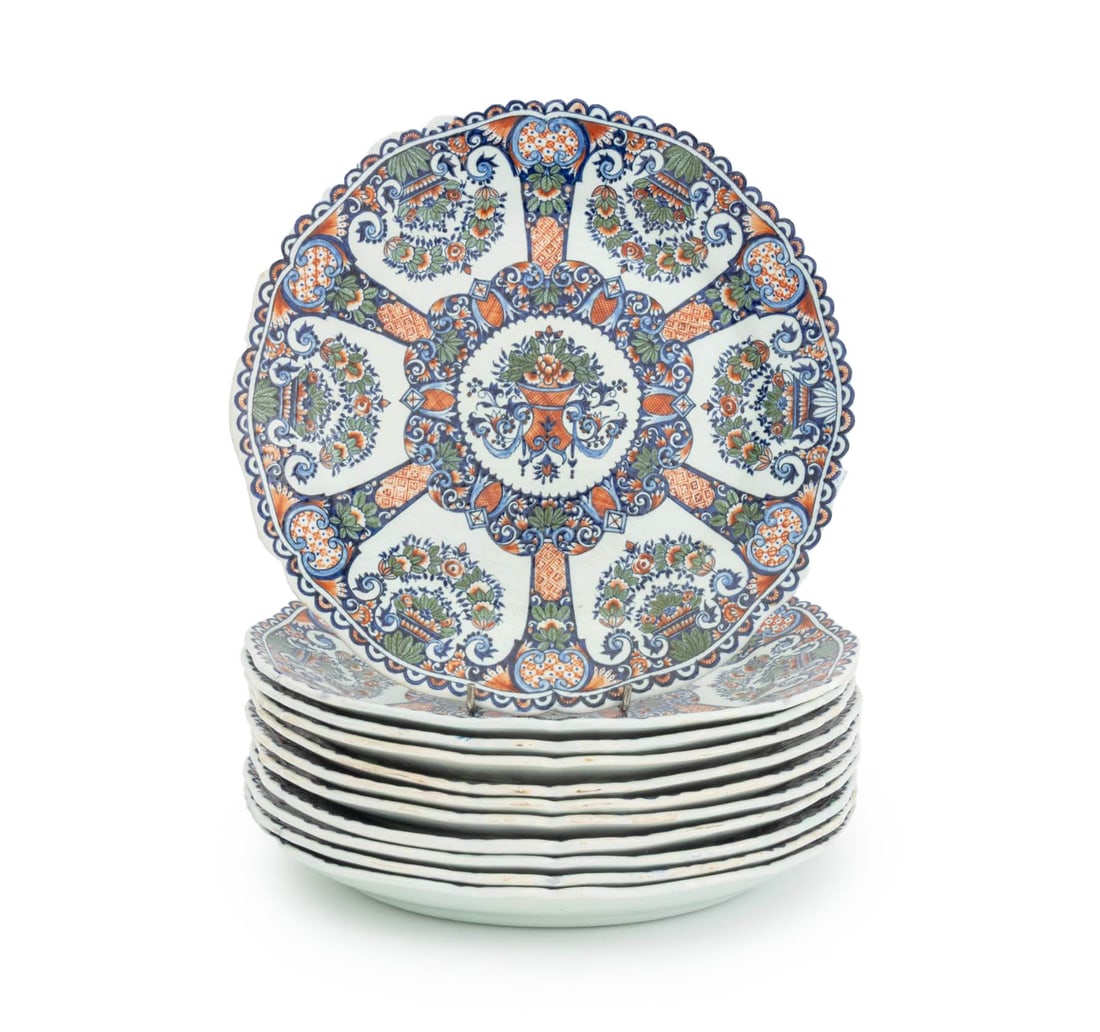 French Floral Decorated Faience Plates, 11: Set of 11 French Floral Decorated Faience Plates, with scalloped rim, marked to undersides. 10.75" Diameter x 1.25" H. Provenance: From a 21 East 87th Street Estate. Keywords: European ceramics,