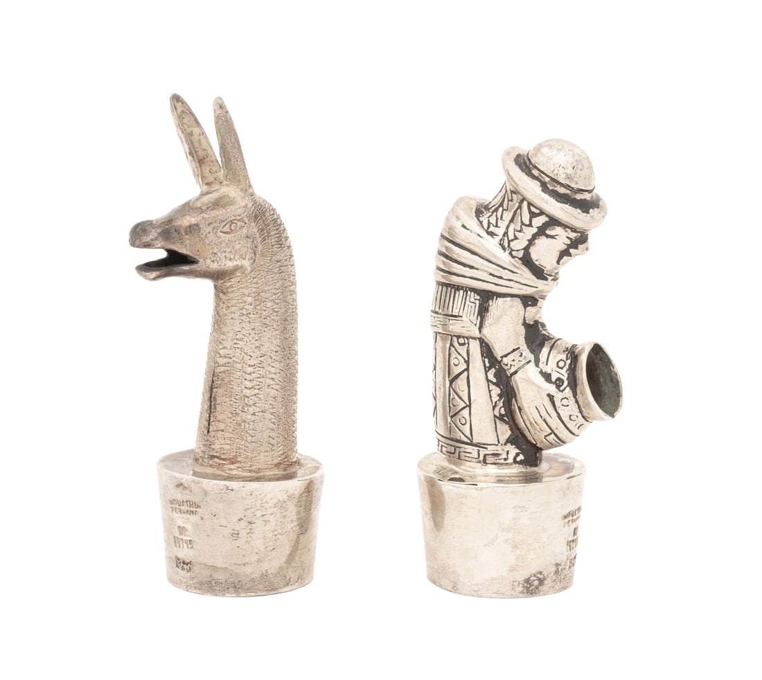 Peruvian Figural Sterling Silver Wine Stoppers, 2: Two Peruvian Figural Sterling Silver Wine Bottle Stoppers, one in the form of a llama head and one a water bearer, both marked "Industrial Peruana / R1 14749 / 925". Weight: 1.66 ozt.; taller: 3" H x 