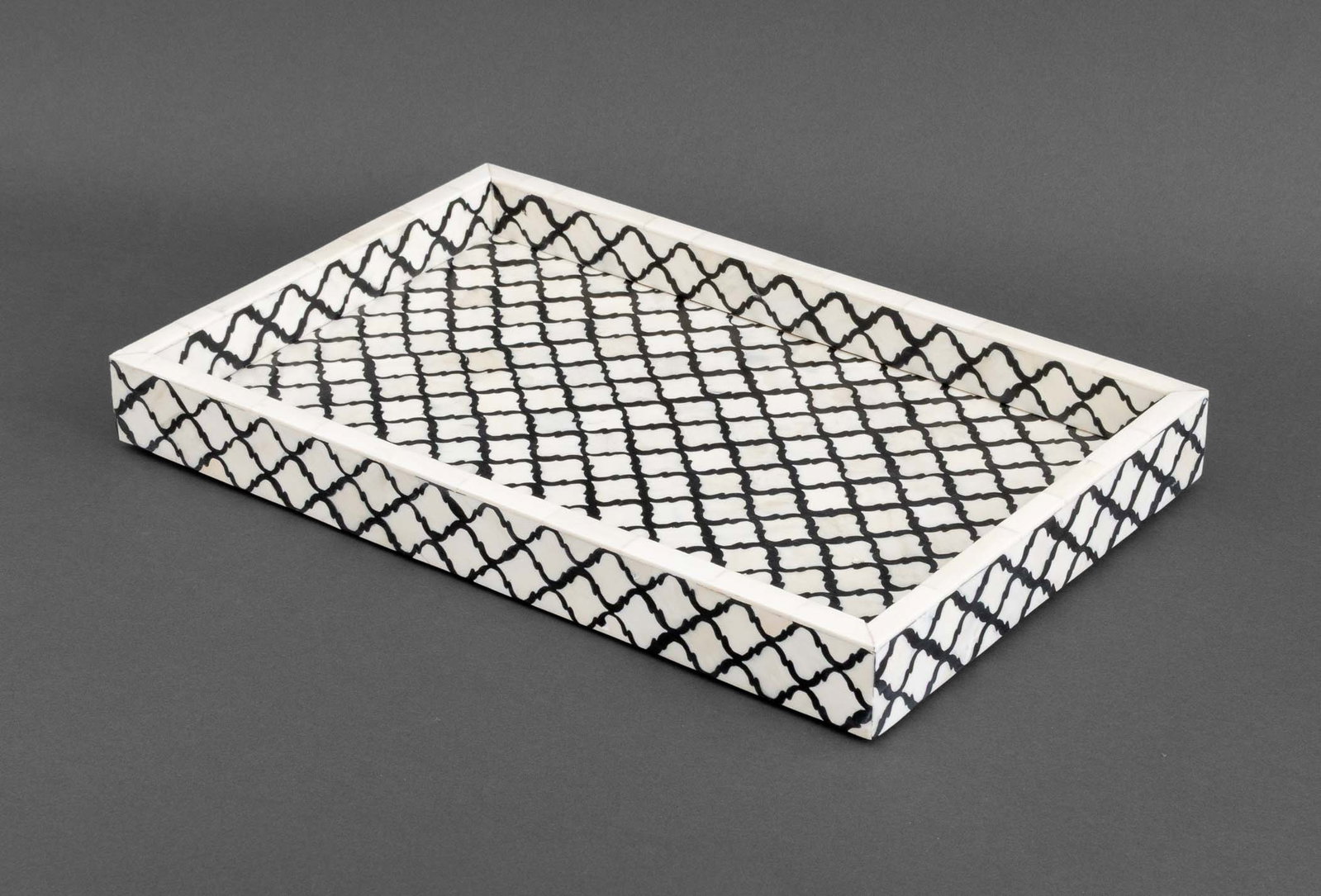 Modern Bone Inlay Ebony Quatrefoil Serving Tray: Modern Bone Inlaid Ebony Quatrefoil Design Serving Tray. 2" H x 17" W x 11.25" D. Provenance: From a 35 Sutton Place Estates. Keywords: Drinks tray, Handmade, Tableware, Platter, Dining, Table decor, 