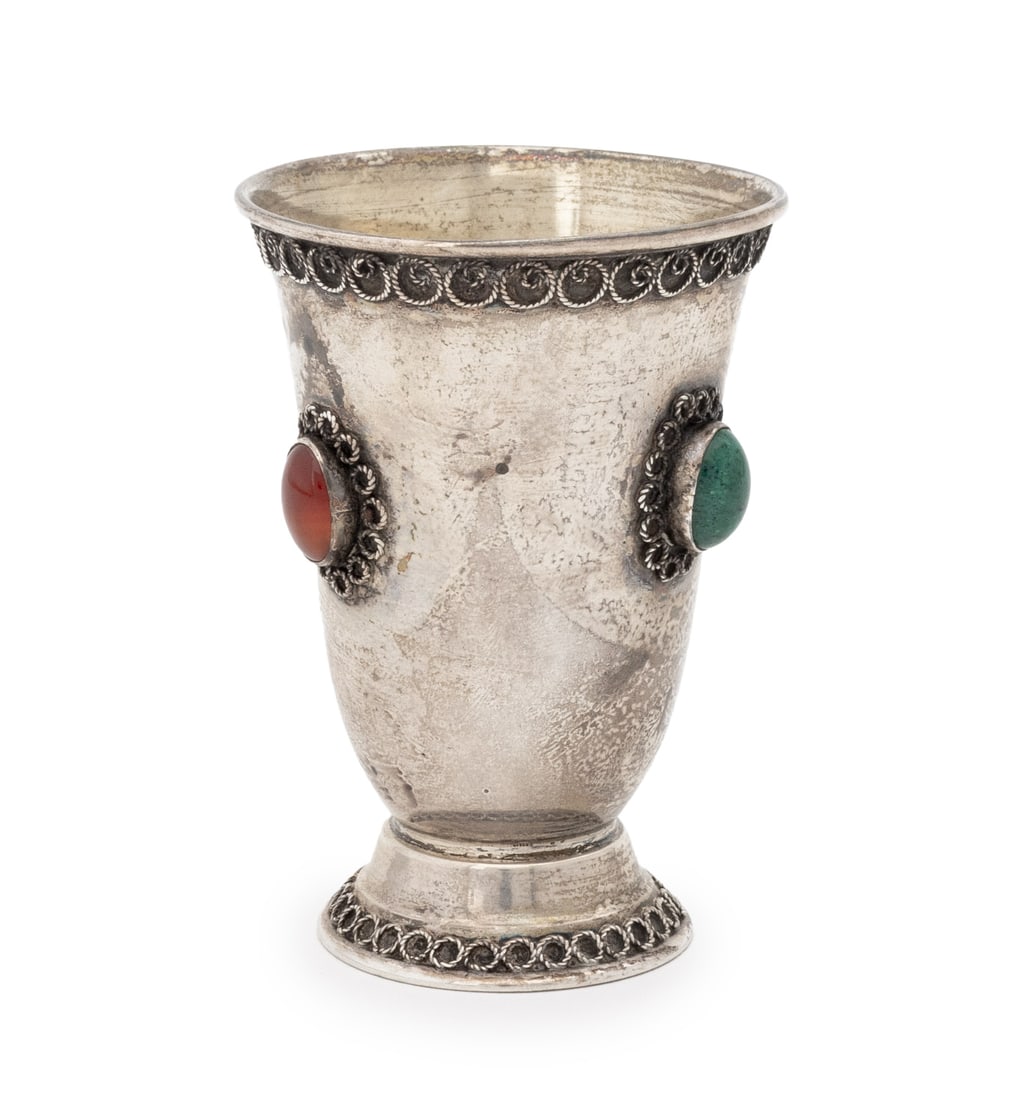 Crystal Mounted Sterling Silver Kiddush Cup: Crystal Mounted Sterling Silver Kiddush Cup, with gold-washed bowl, tiger's eye, carnelian, and green stone cabochons, and scrollwork design, marked "925" and obliterated marks to underside. Weight: 1