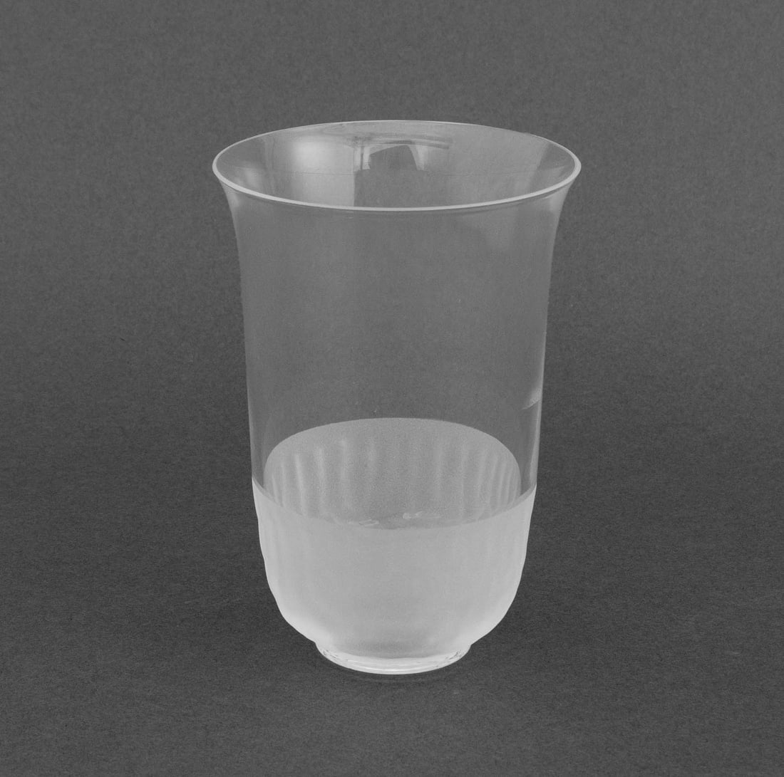 Gucci Clear and Frosted Glass Cup: Gucci Clear and Molded Frosted Glass Cup, with scale motif to lower half, marked "Gucci Made in Italy" to the underside. 4.25" H x 3" Diameter. Provenance: From a 35 Sutton Place Estate. Keyword: Glas