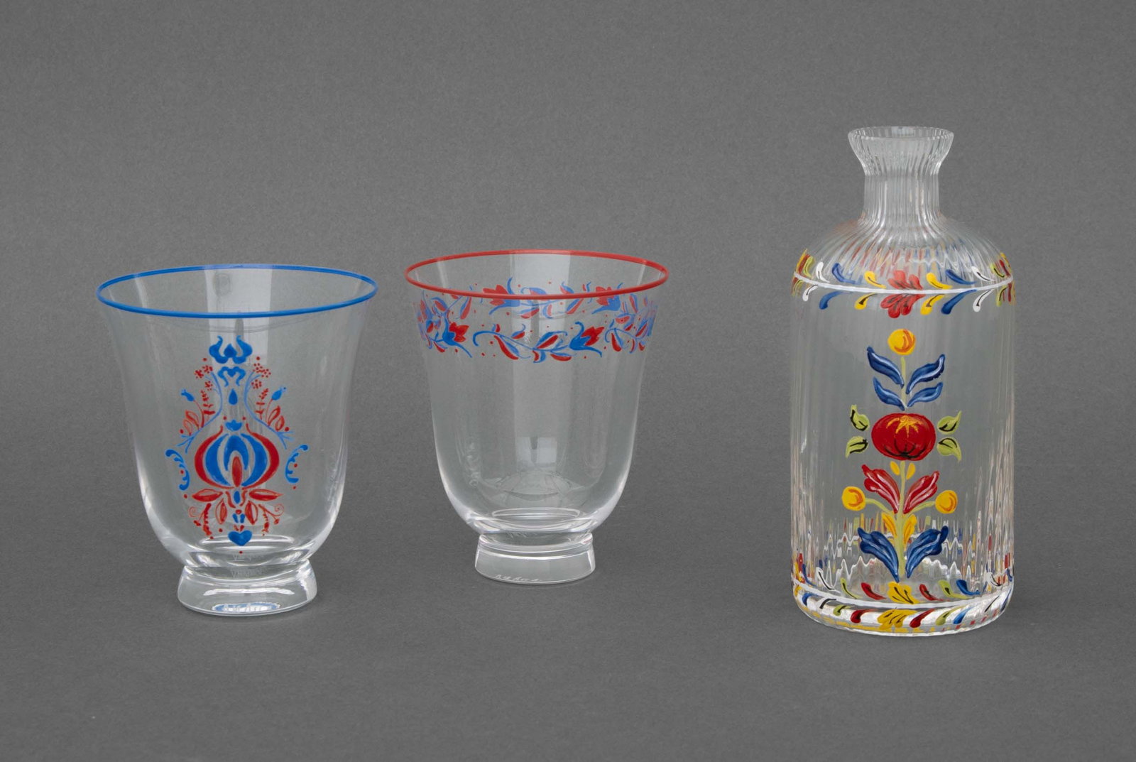 Cabana Foliate Motif Painted Glass Vessels, 3: Collection of Three Cabana Foliate Motif Hand-Painted Glass Vessels, each marked and comprising: two drinking cups and a bottle vase. Tallest: 6.25" H x 2.75" Diameter. Provenance: From the Collection