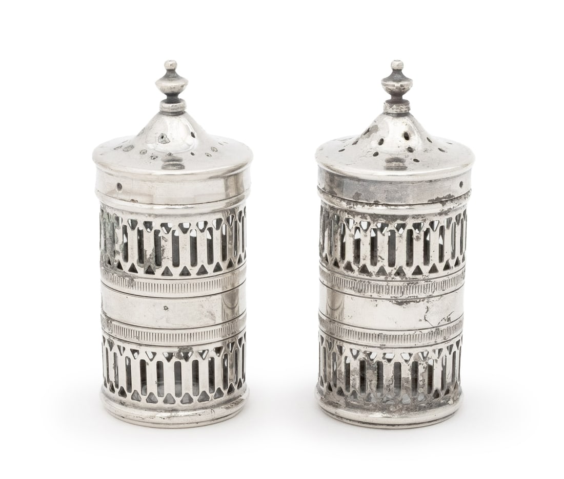 Tiffany & Co. Silver Plate Pierced Salt Shakers, 2: Pair of Tiffany and Company Silver Plate Pierced Salt Shakers, with clear glass liners, marked to undersides. 3.25" H x 1.5" Diameter. Provenance: From a New York City Collection. Keywords: American