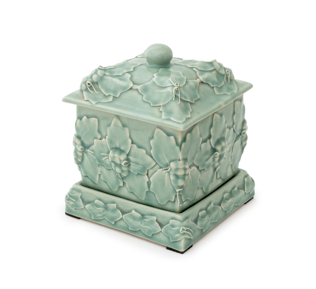 Maitland-Smith Celadon Covered Jar on Stand: Maitland-Smith Celadon Glazed Ceramic Covered Jar on Stand, gold-tone label to underside of jar. Overall: 9.75" H x 8" W x 8" D. Provenance: From an East Village Estate. Keywords: Designer, Luxury bra