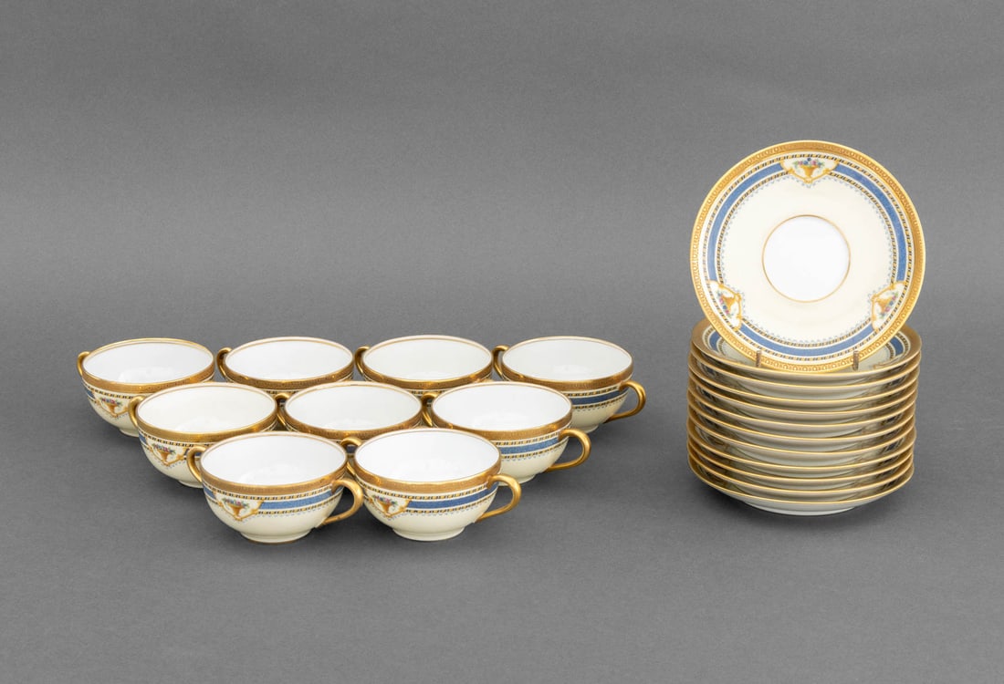L. Bernardaud & Co. Bouillon Cups & Saucers, 21: L. Bernardaud and Company Limoges Porcelain Bouillon Cups and Saucers, comprising: (9) nine teacups and (12) twelve saucers, with floral urn motif, marked to undersides. Overall: 2.5" H x 5.75" Diamet