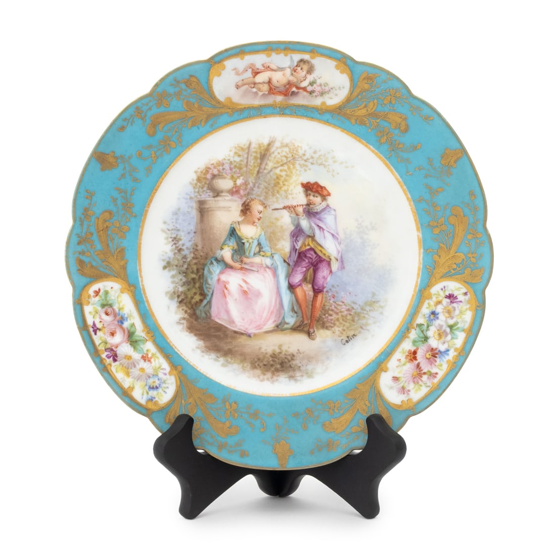 Sevres Bleu Celeste Porcelain Display Plate: Sevres Bleu Celeste Porcelain Display Plate, with scalloped rim and figural courting scene to center, double L mark to underside. 8.75" Diameter. Provenance: From a New York City Collection. Keywords: