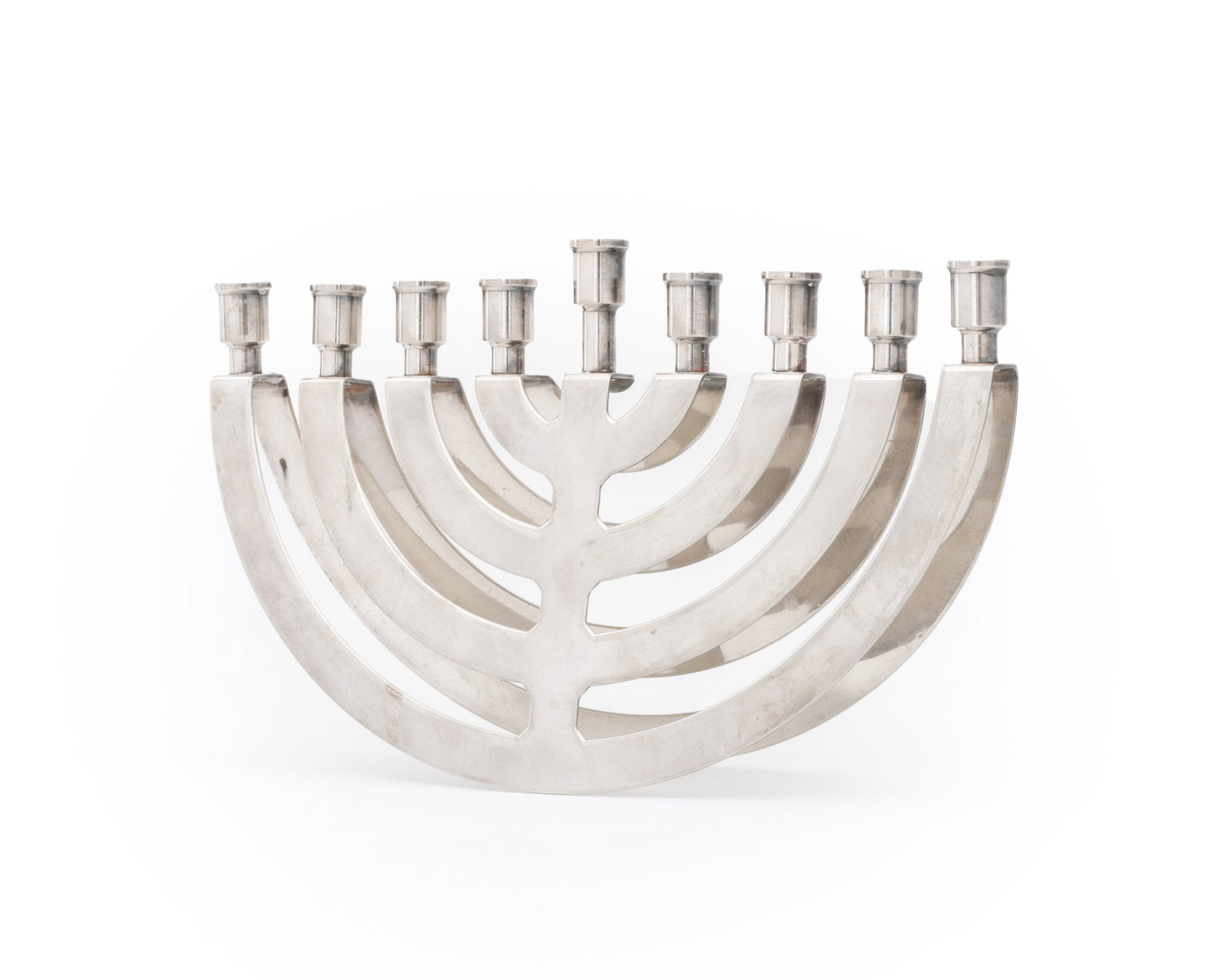 Postmodern Silver Plate Balancing Menorah: Postmodern Silver Plate Balancing Menorah, apparently unmarked. 6.25" H x 10" W x 2.25" D. Provenance: From a New York City Collection. Keywords: Judaica, Judaism, Lighting, Candelabra, Candlestick,