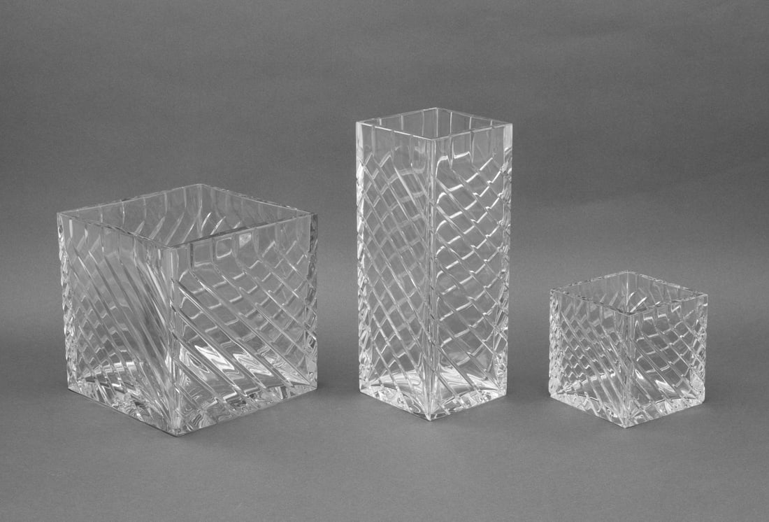 Baccarat Crystal "Kalimnos" Vases, 3: Set of Three Baccarat Crystal "Kalimnos" Pattern Vases, comprising: two square and one rectangular, each with acid-etched mark to underside. Tallest: 12" H x 4.5" W x 4.5" D. Provenance: From a 500