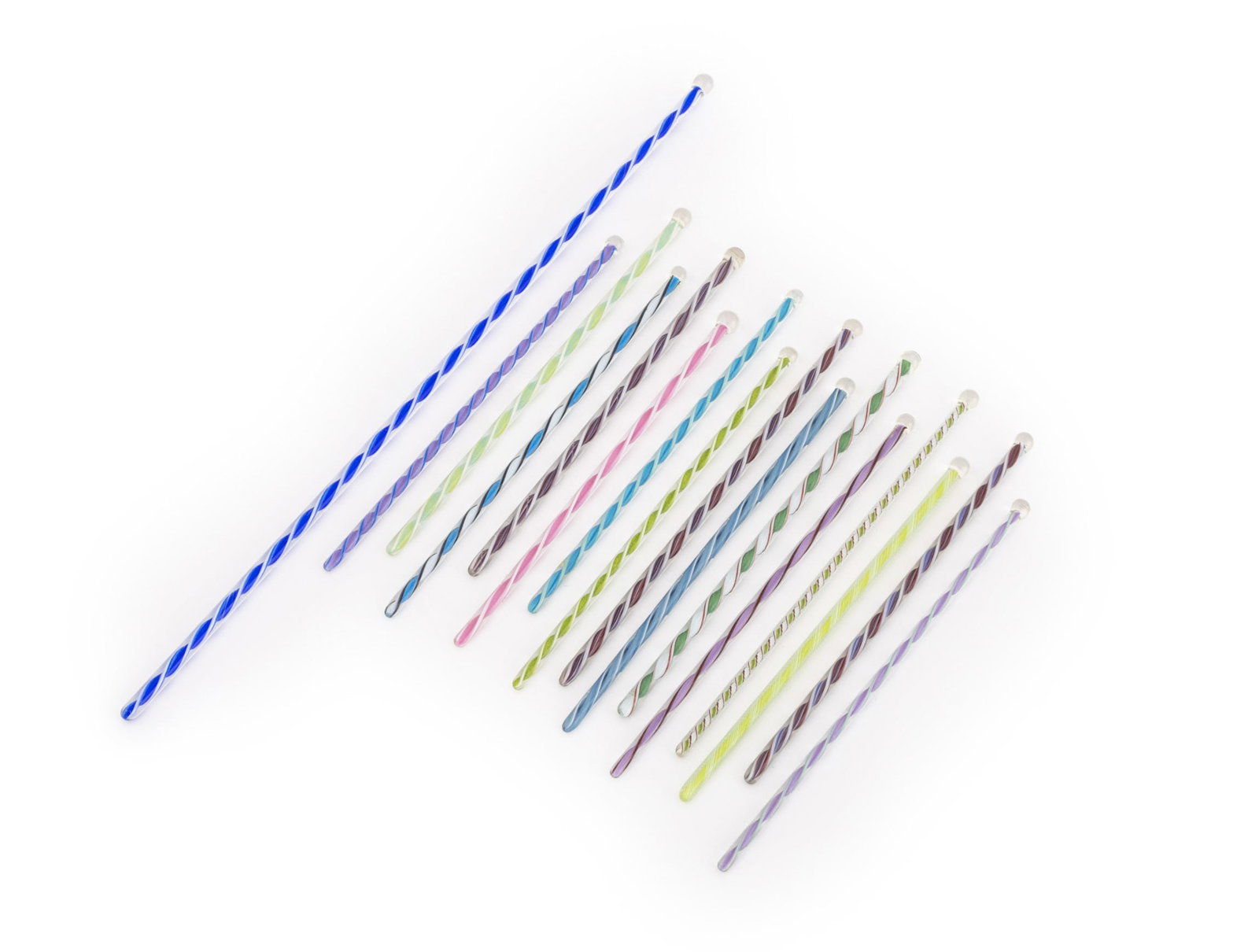 Murano Glass Cocktail Stirrers, 16: Set of Sixteen Murano Glass Cocktail Stirrers, one larger for stirring a batch of cocktails and (15) fifteen personal sized. Largest: 15" L x 0.25" Diameter. Provenance: From a 35 Sutton Place