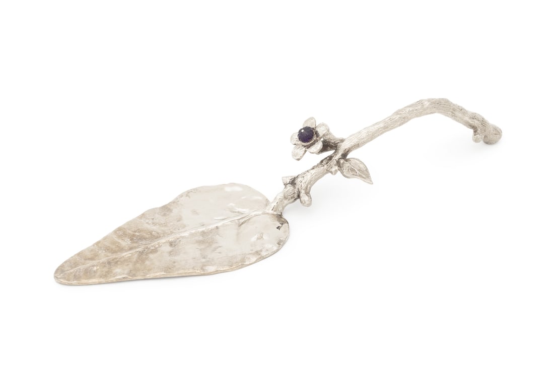 Modern Leaf and Branch Form Cake Server: Modern Leaf and Branch Form Silver-Tone Metal Cake Server, with five petal flower and amethyst glass bead detail. 11.75" L x 3.25" W x 1.75" D. Provenance: From a New York City Collection. Keywords:
