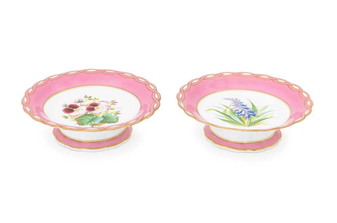 English Floral Motif Porcelain Cake Stands, 2: Two English Floral Motif Porcelain Cake Stands, each with scalloped edge and pink rim, one with pink geraniums and the other with hyacinths, apparently unmarked. 9.5" Diameter x 2.75" D. Provenance: