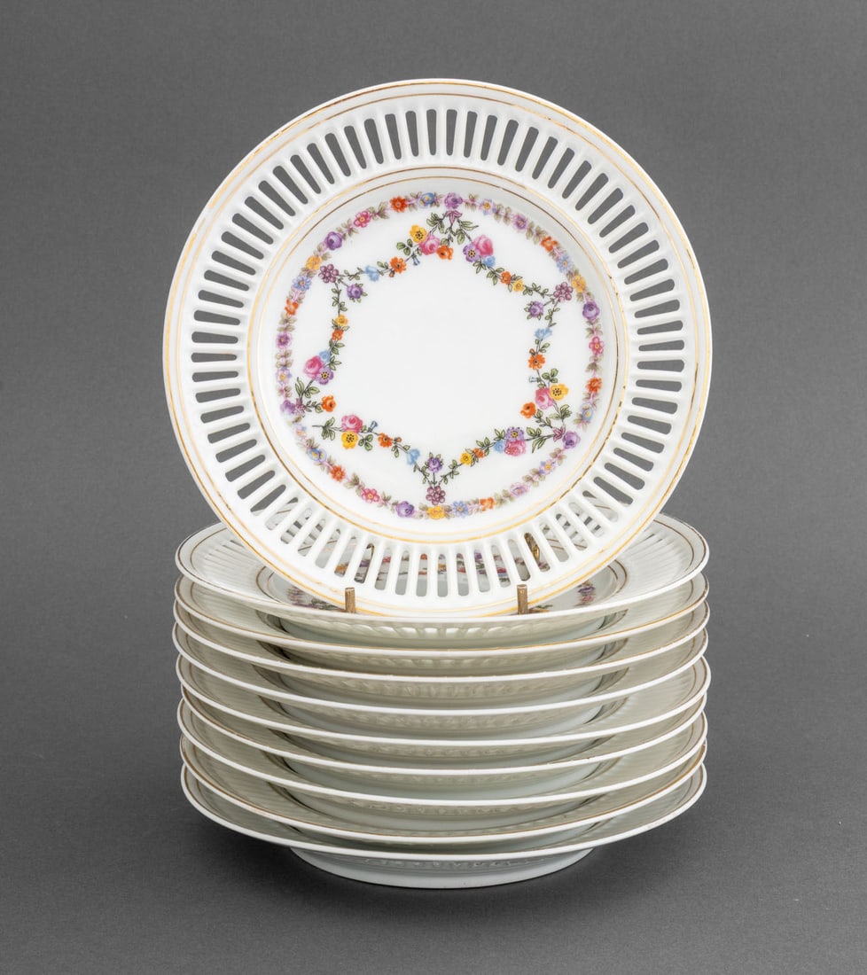 Union K Porcelain Dessert Plates, 10: Set of Ten Union K Porcelain Dessert Plates, 1921-1929, each with double gilt edge and openwork pierced rims, the cavetti decorated with garlands of flowers, each marked to underside. 7.75" Diameter. 