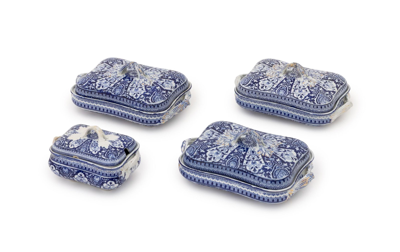 British Blue and White Ceramic Covered Tureens, 4: Set of Four British Blue and White Ceramic Two Handled Covered Tureens, three large and one small, gilt decorated, each with British design registration diamond to underside. Larger: 5" H x 11" W x 7.