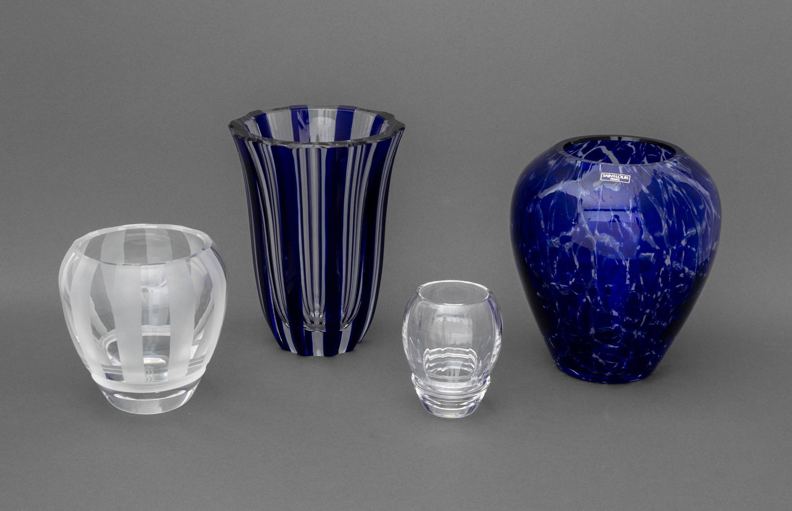 Saint-Louis Crystal Vases and Candle Holder, 4: Collection of Four Saint-Louis Crystal Vessels, comprising: blue and clear glass striped vase, marked to underside, blue and clear glass marbled pattern, with "Saint-Louis / France" label and marked t