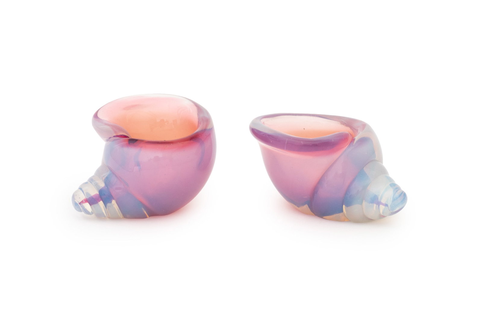 Nautilus Shell Form Opaline Glass Bowls, Pair: Pair of Nautilus Shell Form Opaline Glass Diminutive Bowls, each with cranberry red glass interior. 2.25" H x 3.75" W x 3" D. Provenance: From a New York City Collection. Keywords: Art Glass, Studio G