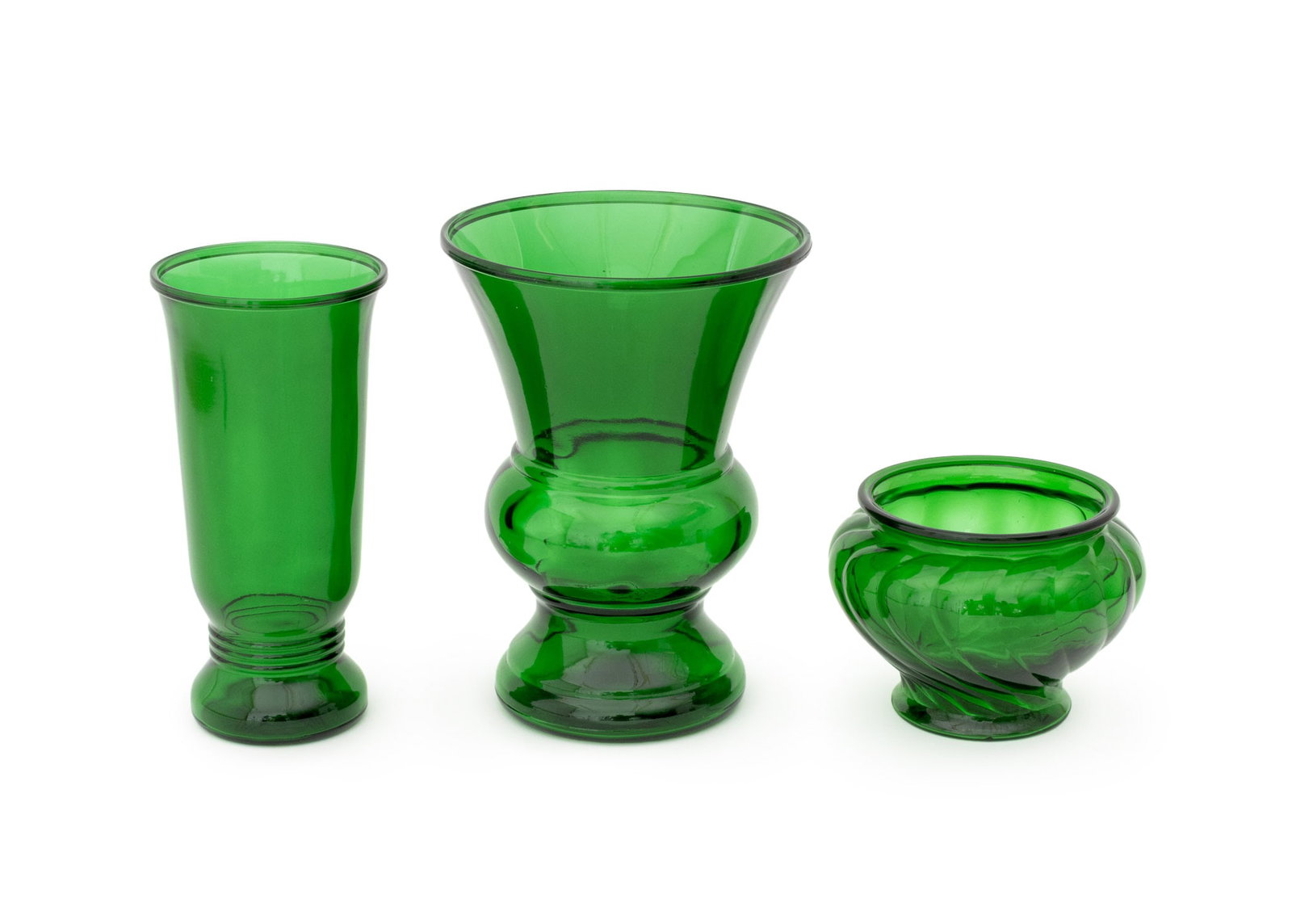 Napco Emerald Green Glass Vases, 3: Collection of Three Napco Emerald Green Glass Vases, two marked "Napco / Cleveland, O. USA", and comprising: model numbers 1168, 1192, and 1172. Largest: 10" H x 7.5" Diameter. Provenance: From an Eas