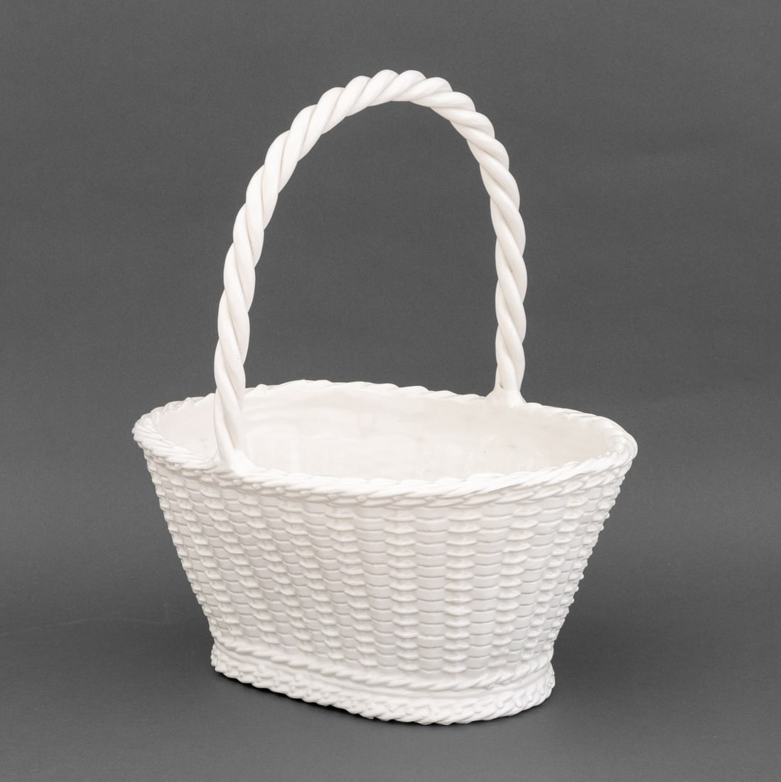 Tiffany & Co. Italian White Glazed Ceramic Basket: Tiffany and Company Italian White Glazed Ceramic Basket, marked "452 / Made in Italy / for / Tiffany" to underside. 18.5" H x 15.75" W x 12.5" D. Provenance: From a 500 Park Avenue Estate. Keywords: D