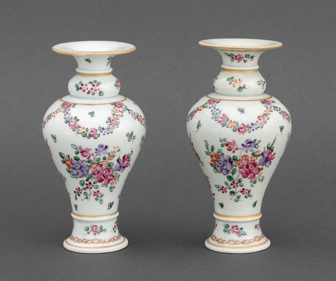 Samson of Paris Porcelain Diminutive Vases, Pair: Pair of Samson of Paris Porcelain Diminutive Vases, each hand-painted with floral garlands and with pseudo-Chinese marks to underside. 6.25" H x 3.25" Diameter. Provenance: From the Collection of Anna