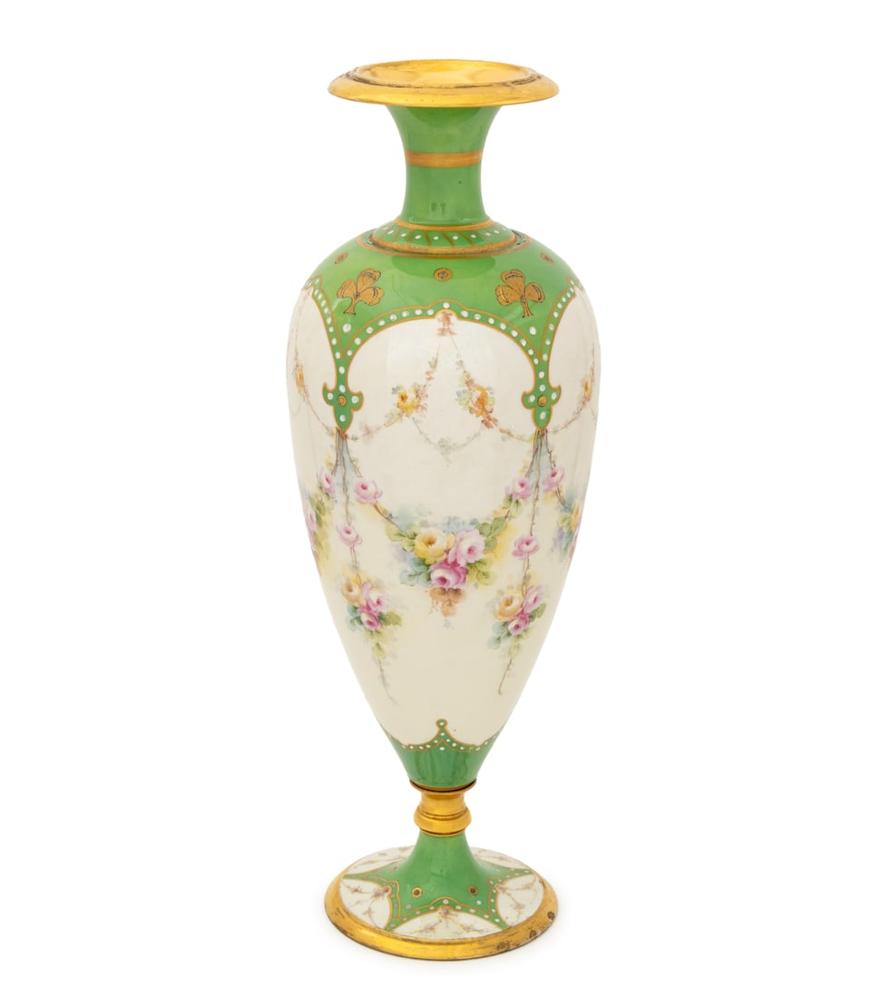 William Guerin & Co. Limoges Porcelain Vase: William Guerin and Company French Limoges Porcelain Vase, with floral swags, green glaze, and gilt accents, signed and marked to underside. 22" H x 7.5" Diameter. Provenance: From a New York City Coll