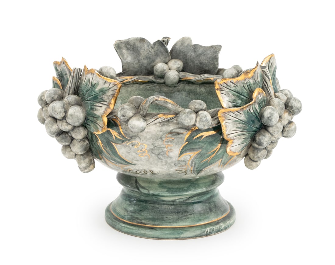 Freeman Leidy Majolica Punch Bowl: Freeman Leidy Majolica Punch Bowl, greenish-blue glazed ceramic with gilt accents and raised grape bunches, leaves, and vines, marked to underside. 8.75" H x 13" Diameter. Provenance: From a Central P
