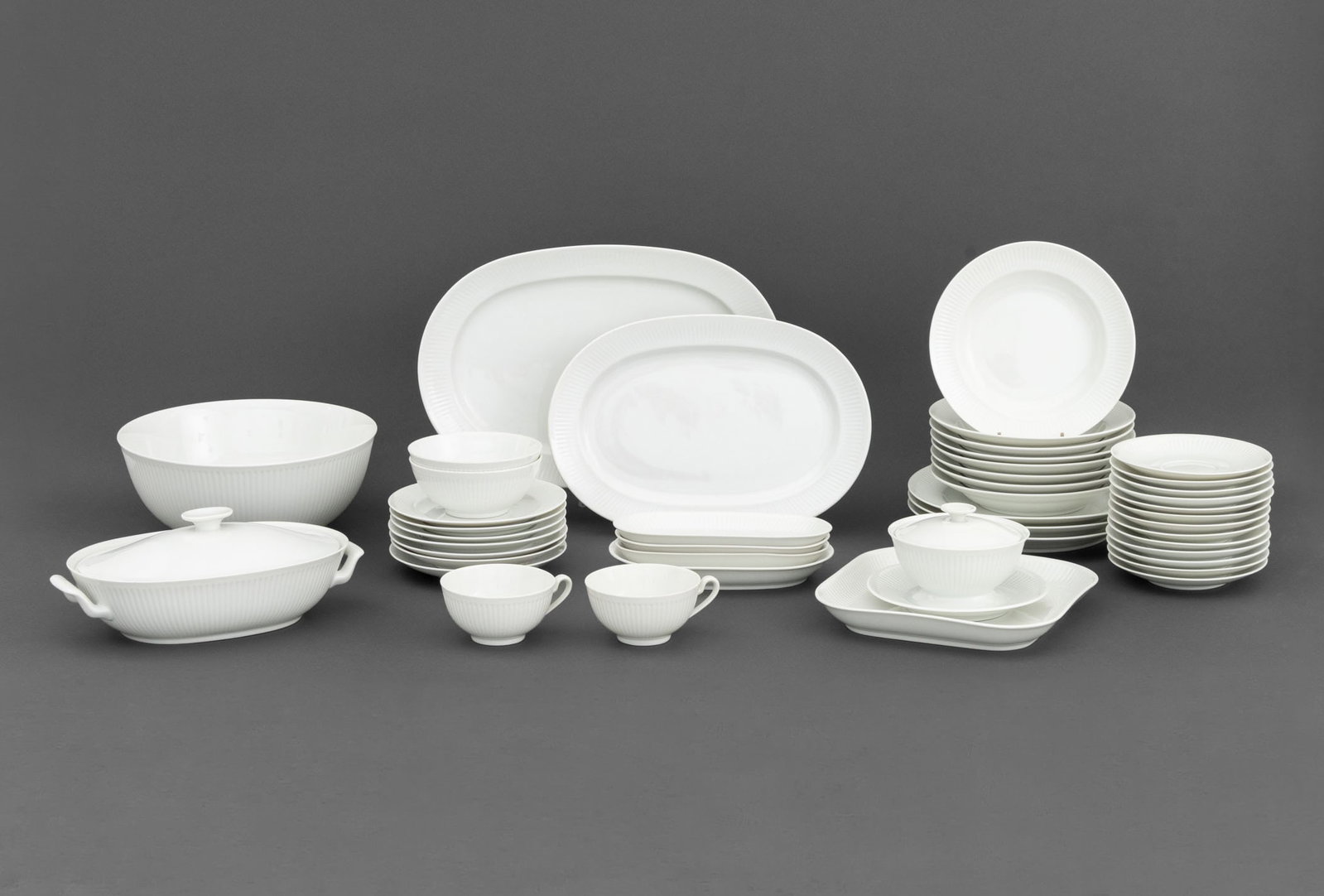 Royal Copenhagen Porcelain Partial Service, 45: Royal Copenhagen Porcelain Partial Dinnerware Service, comprising: (3) three dinner plates, (8) eight soup bowls, (7) seven bread and butter plates, (2) two cereal bowls, (2) two teacups, (1) one circ