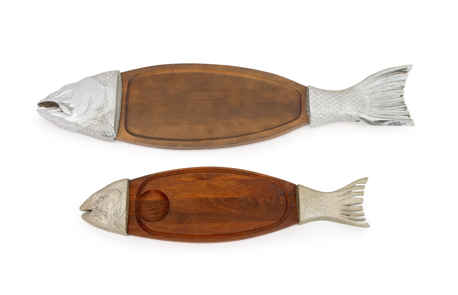 Modern Salmon Form Metal and Wood Platters, 2: Two Modern Salmon Form Metal and Wood Serving Platters, one marked "T.C.C." to underside. Larger: 3" H x 35" W x 8.5" D. Provenance: From a Forest Hills Gardens Estate. Keywords: Tableware, Dining, Di