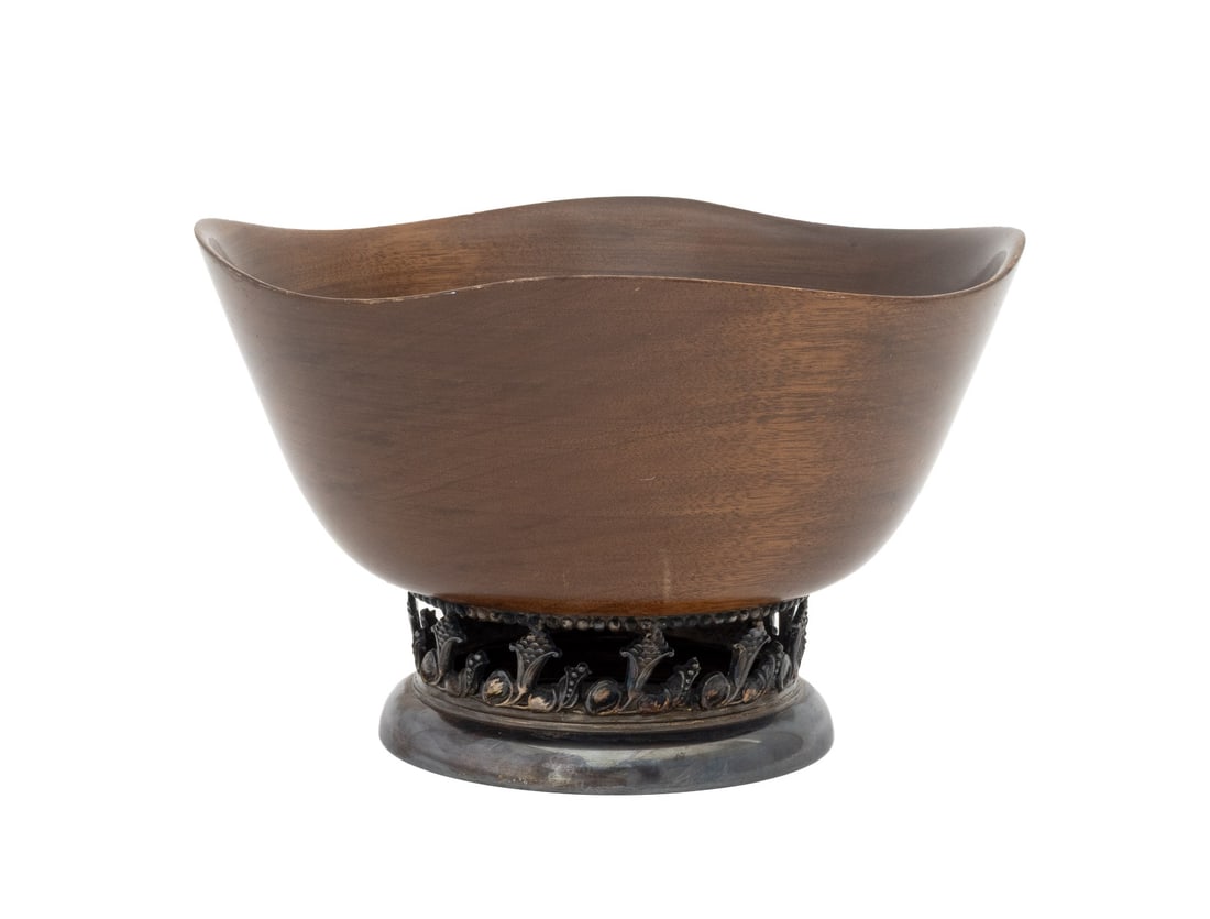 Mid-Century Modern Walnut and Silver Plate Bowl: Mid-Century Modern Walnut and Silver Plate Centerpiece Bowl, the pierced foot with scrolling foliate motif. 7.5" H x 11.75" Diameter. Provenance: From a New York City Collection. Keywords: MCM, Vintag