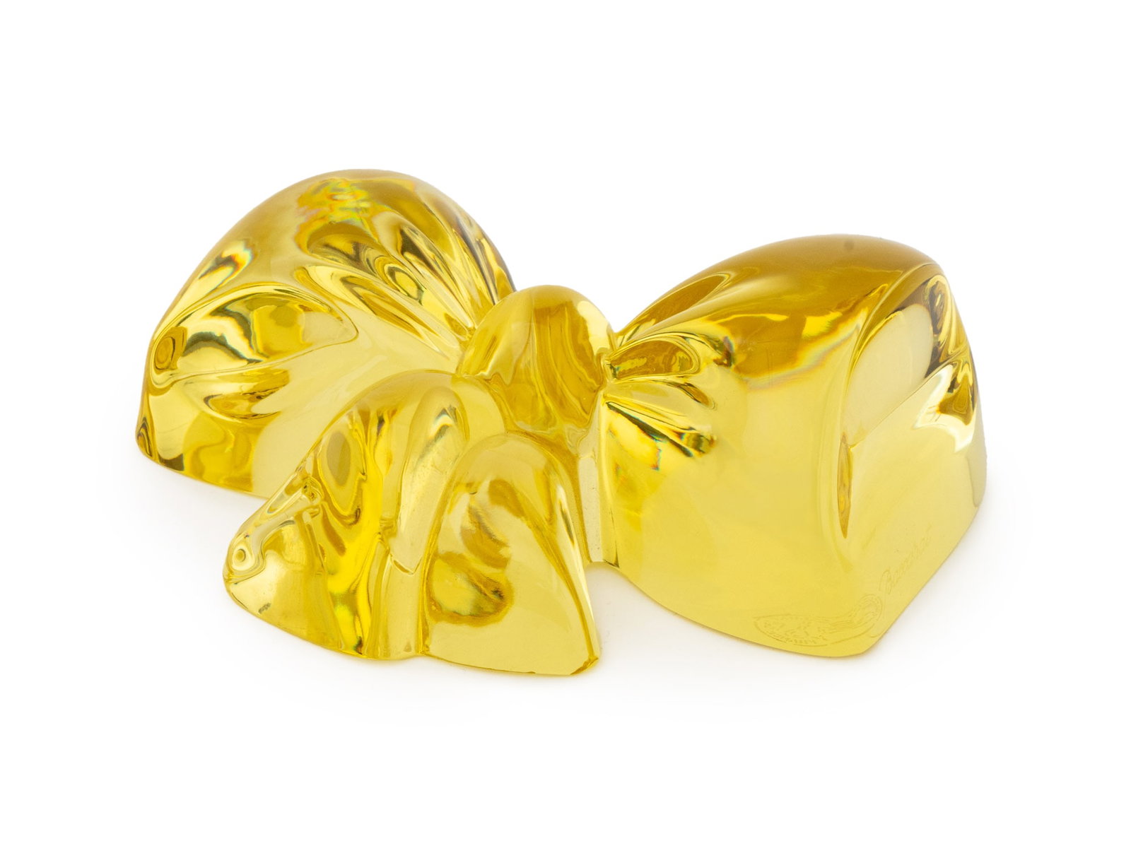 Baccarat Crystal Bow Form Paperweight: Baccarat Crystal Yellow Bow Form Paperweight, marked "Baccarat France" to underside. 1.5" H x 4" W x 3.5" D. Provenance: An East 75th Street Collection. Keywords: French cristal, Designer, Luxury