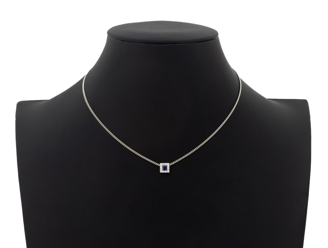 Carl F Bucherer 18K Gold Sapphire Diamond Necklace: Carl F. Bucherer 18K White Gold Sapphire Diamond Necklace, designed as fixed 18K white gold square pendant slide, adorned with one square step cut blue sapphire weighing approx. 0.30 carats, further a