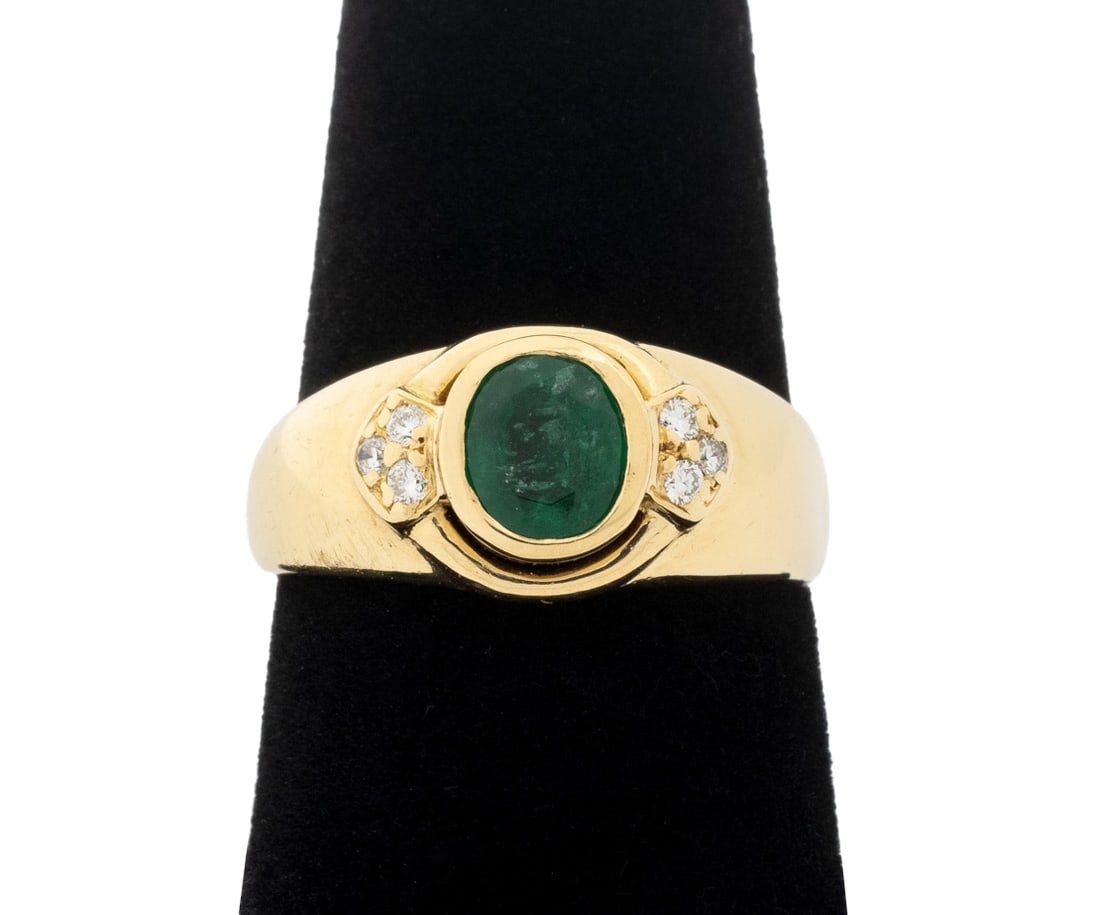 Modern 18K Yellow Gold, Emerald, and Diamond Ring: Modern 18K Yellow Gold, Emerald, and Diamond Ring, featuring one bezel set round brilliant cut emerald weighing approx. 0.80 carat, further adorned with six pave set round brilliant cut diamonds weigh