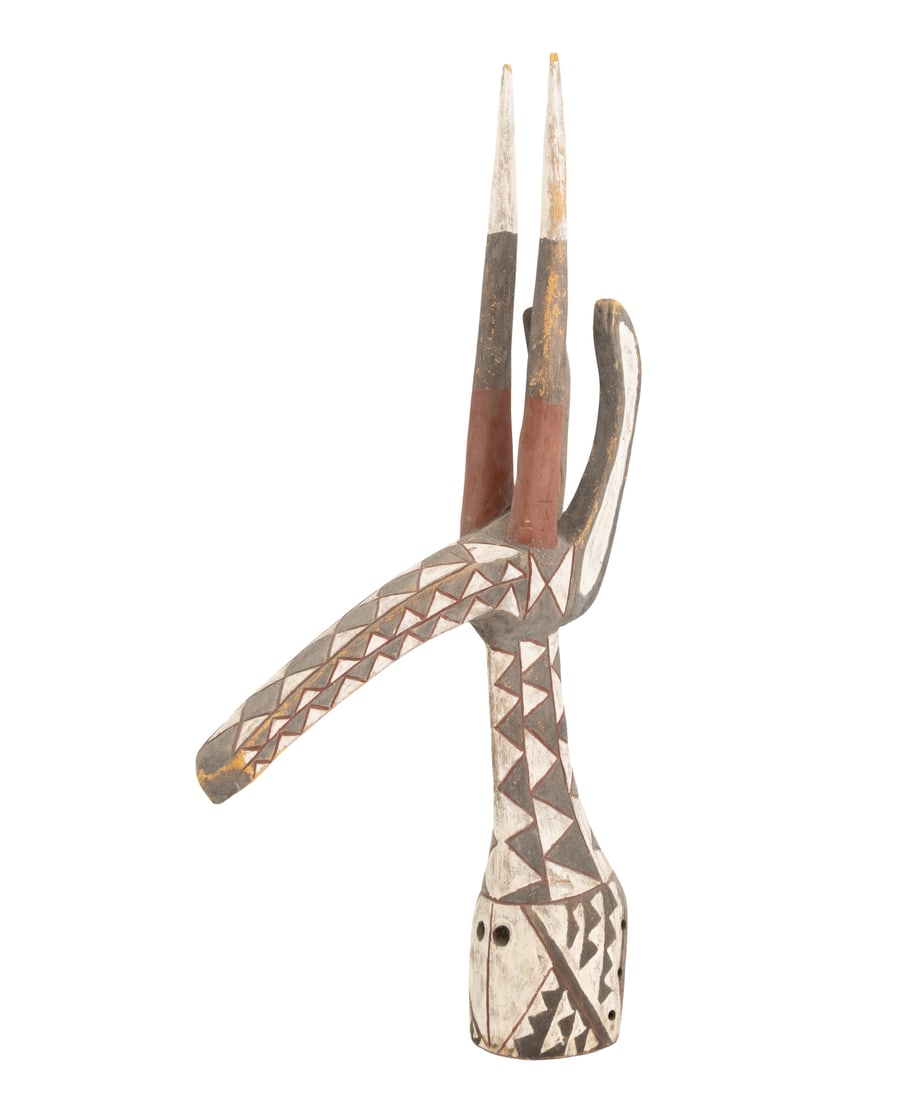 Kurumba Adone Antelope Headdress: Kurumba Adone Antelope Headdress, Burkina Faso, 20th century, carved and polychrome-painted wood. 42" H x 21" W x 6.75" D. Provenance: A Sutton Place Collection. Keywords: Berba, West African Art, Car