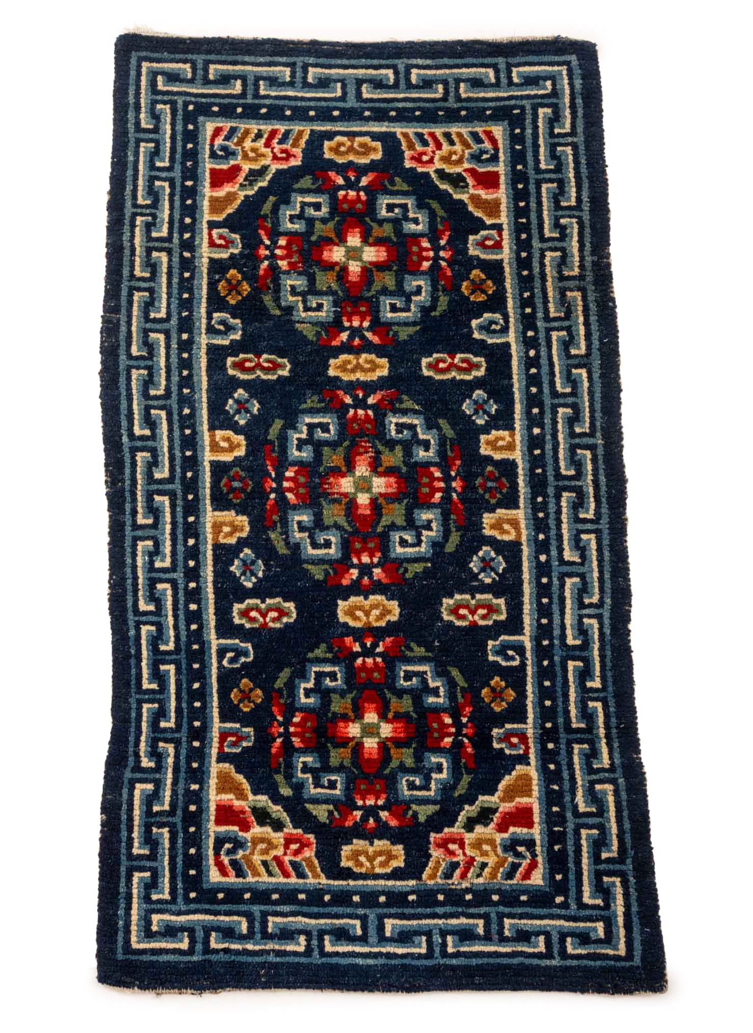 Tibetan Gyantse Khaden Rug, 4' 4.5" x 2' 3.5": Tibetan Gyantse Wool Khaden Rug, with stylized floral motifs on a blue ground. 4' 4.5" L x 2' 3.5" W. Provenance: From the Estate of Joseph Lawrence Gardella. Keywords: Himalayan Art, Textiles, Carpet