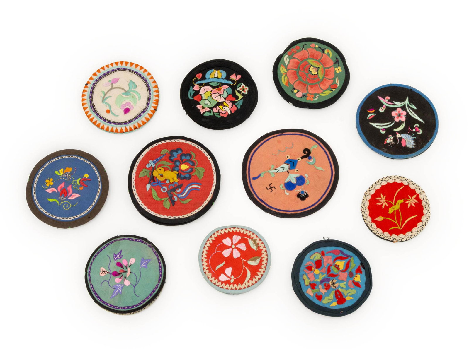 Chinese Silk Embroidered Roundels, 11: Group of Eleven Chinese Silk Embroidered Roundels, with floral designs. Largest: 4.25" Diameter. Provenance: A Sutton Place Collection. Keywords: Asian Arts, Chines embroidery, China, Textile Art, Art