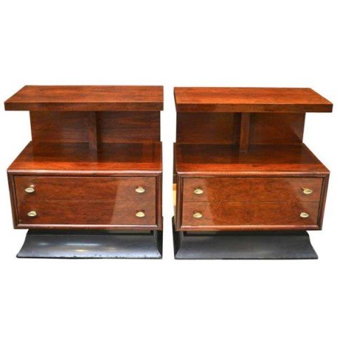 Pair of Art Deco Style Mahogany Bedside Tables: Pair of masterfully crafted pair Art Deco style mahogany bedside tables. These nightstands are mounted on ebonized wood bases. c 1940s-1950s, United States. Dimensions: Each 25-1/2" H x 24" L x 15" W