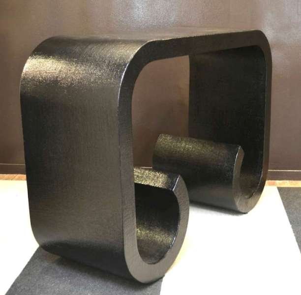 Hollywood Regency Black Lacquered Console Table: Elegant Hollywood Regency black lacquered linen wrapped scroll leg waterfall console table in the style of Karl Springer, c. 1980s, United States. Dimensions: 32" H x 44-3/4" L x 16" W