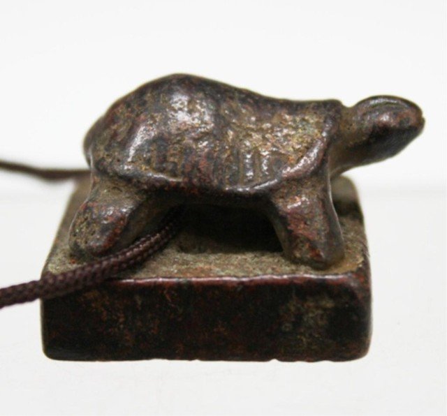 Chinese Bronze Turtle Knob Seal, Eastern Han Dyn.: A bronze knob seal with turtle and string, China, Eastern Han Dynasty (25–220 A.D); marked. Dimensions: 7/8" H x 1" L x 1" W