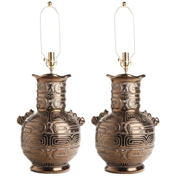Pair of 1960s Art Moderne Gilt Glazed Urn Lamps: Pair of late 1960s Art Moderne gilt glazed ceramic urn form lamps rewired with brass fittings and silk cords, United States. Dimensions: Each 34" H x 16" diameter