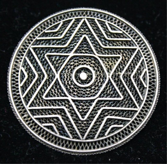 Round Silver Filigree Brooch with 6 Point Star: Circular filigree brooch with six point Jewish star, silver; unmarked. Dimensions: approximately 2" diameter